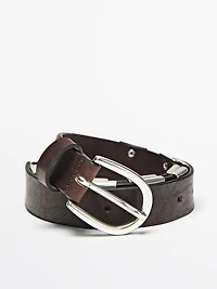 Belt with metal appliqués