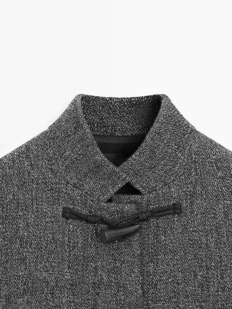 Mid-length coat with horn toggle