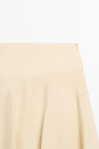 Flowing asymmetric midi skirt