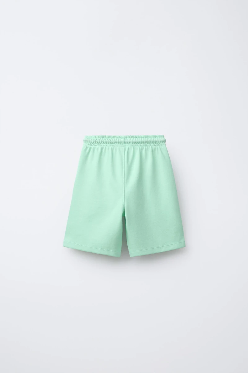 ATHLETIC SHORTS WITH RAISED TEXT