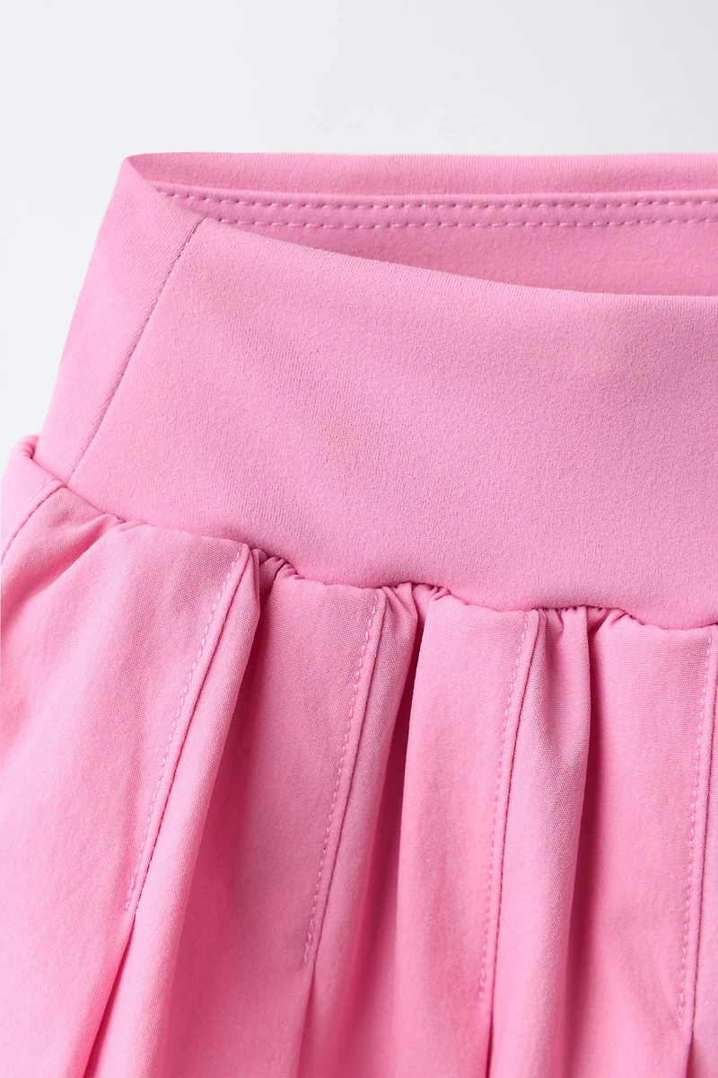 PLEATED BIKE SHORT SKIRT