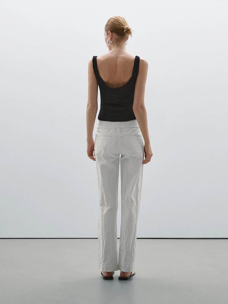Pantalon slim taille basse avec boucles