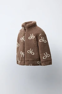 FAUX SHEARLING JACKET WITH BOW PRINT