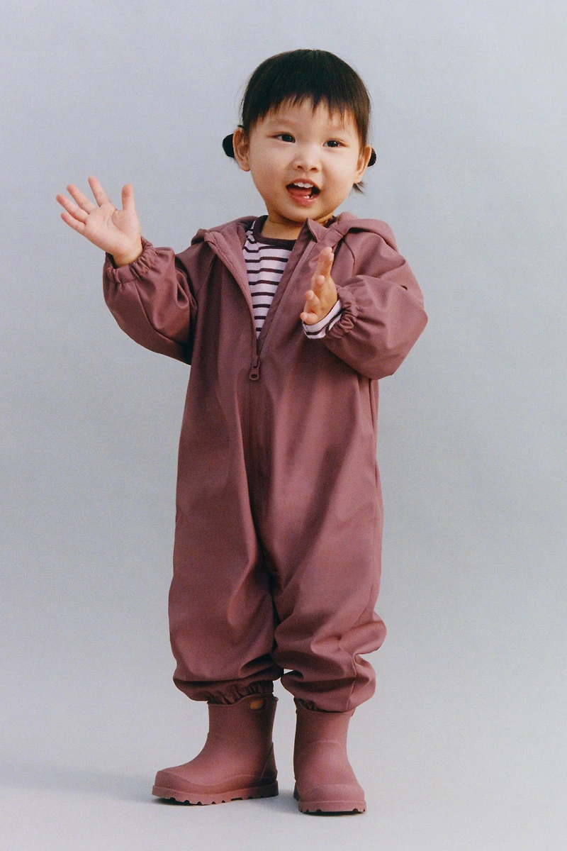 WATER-RESISTANT FLORAL RUBBERIZED JUMPSUIT