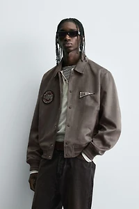 BLOUSON EFFET DAIM PIÈCES ET BRODERIES