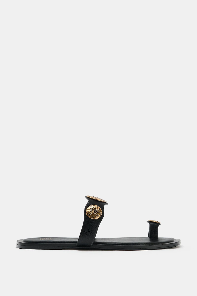 FLAT SANDALS WITH METALLIC DETAILS