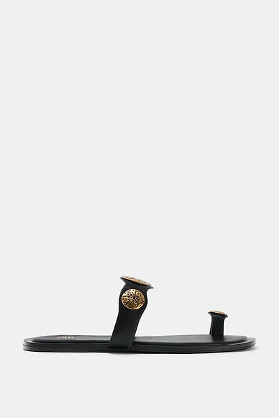 FLAT SANDALS WITH METALLIC DETAILS