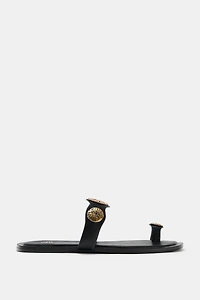 FLAT SANDALS WITH METALLIC DETAILS