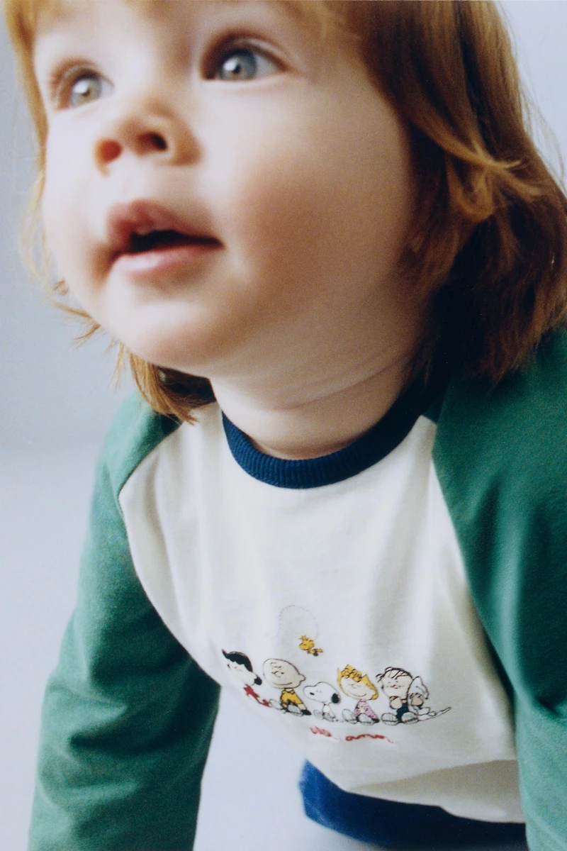 SNOOPY PEANUTS™ RAGLAN SLEEVE T-SHIRT