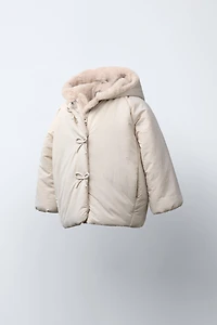 WATER REPELLENT PUFFER COAT WITH BOWS