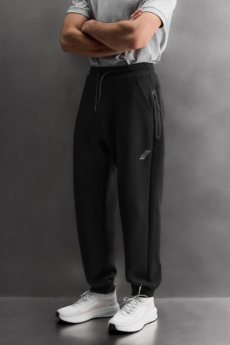 TECHNICAL PANTS WITH ZIPPERS