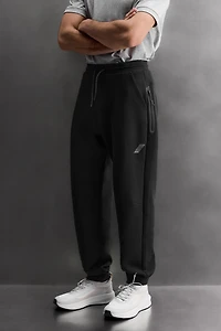 TECHNICAL PANTS WITH ZIPPERS
