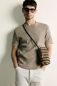 VERTICAL WOVEN CROSSBODY BAG