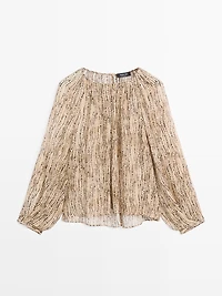 Semi-sheer draped blouse