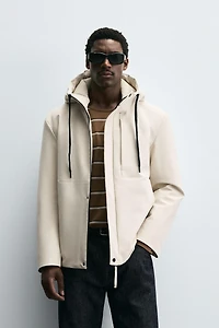 VESTE TECHNIQUE À CAPUCHE
