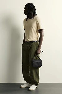 RUBBERIZED CROSSBODY BAG