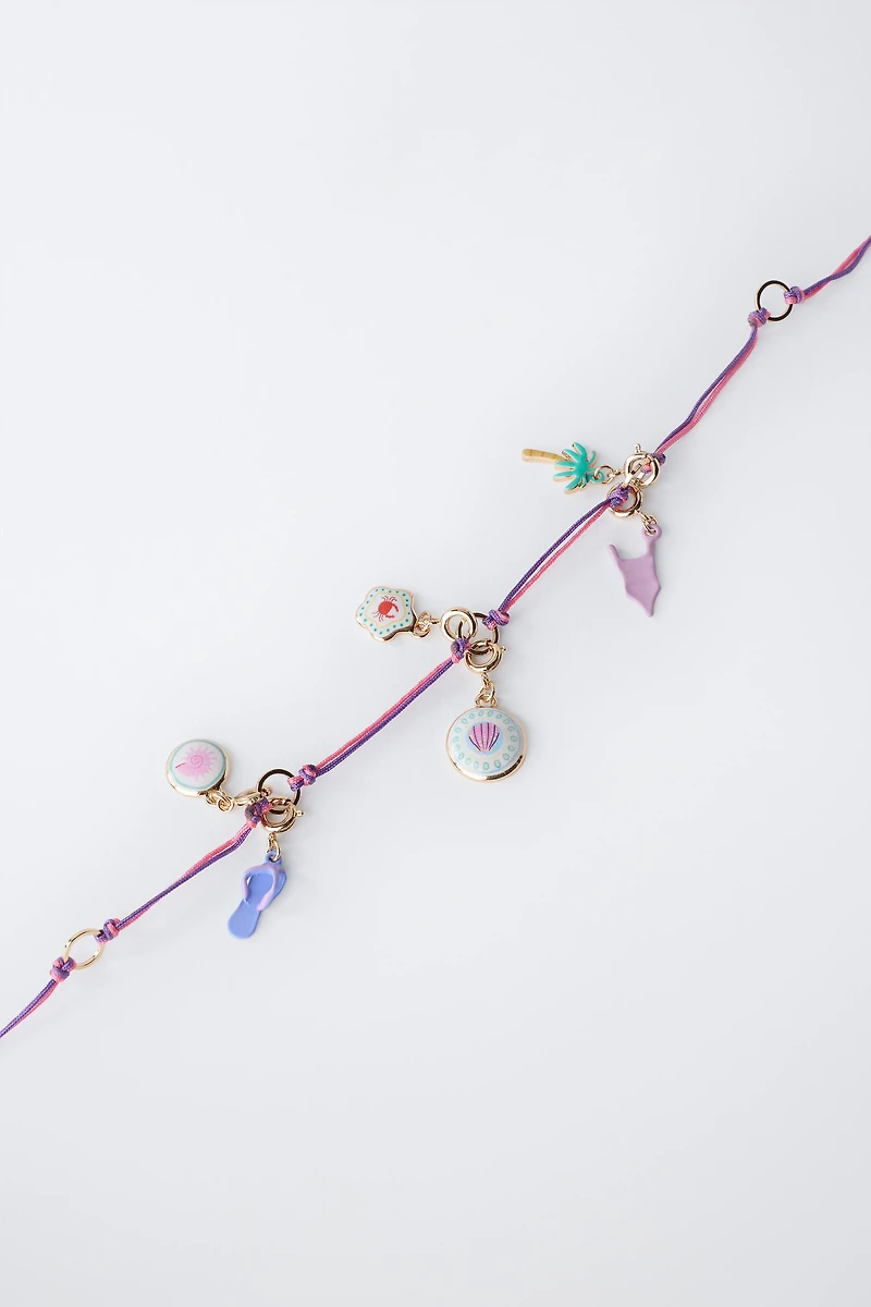 INTERCHANGEABLE MULTI-CHARM NECKLACE