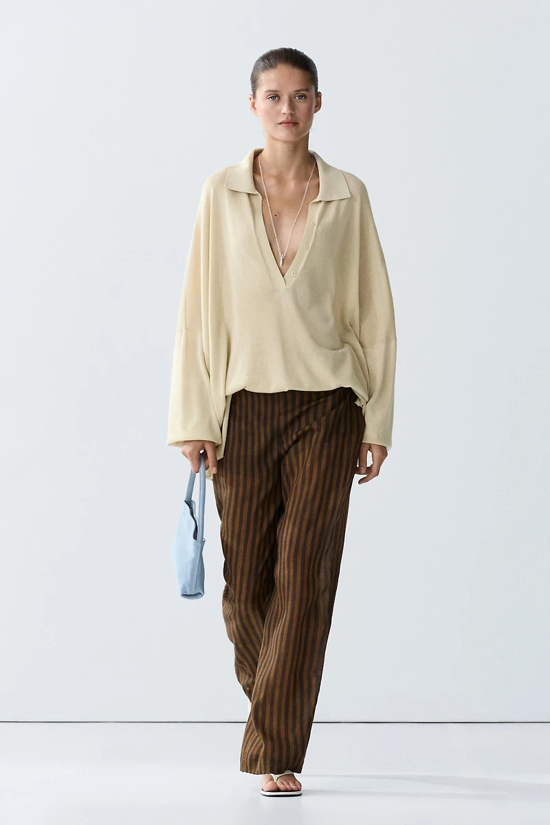 Total look flowing striped pants with button hem