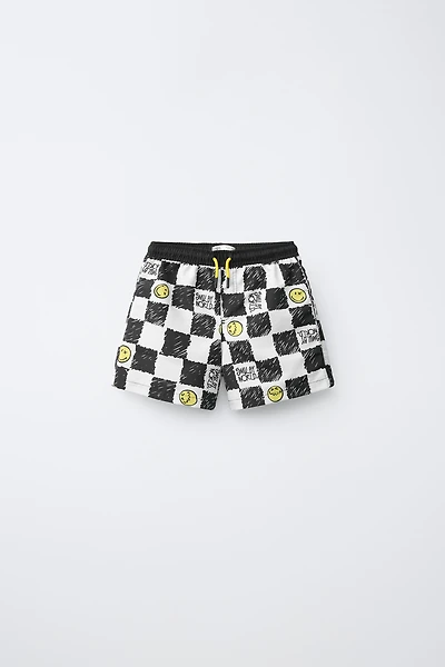 6-14 ANS/ SHORT DE BAIN DAMIER SMILEYWORLD ®