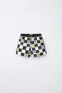 6-14 YEARS/ CHECKERBOARD SMILEYWORLD ® SWIM SHORTS