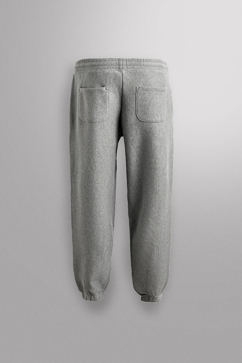 JOGGING PANTS WITH PRINTED TEXT