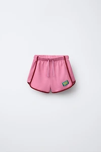 BERMUDA COMBINÉE ÉTIQUETTE