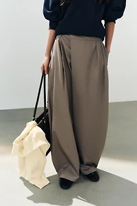 ASYMMETRIC WAIST PLEATED TROUSERS