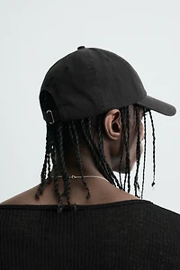 CASQUETTE DÉLAVÉE TEXTE IMPRIMÉ