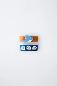 LOT DE DEUX BARRETTES À FLEURS ET OISEAU