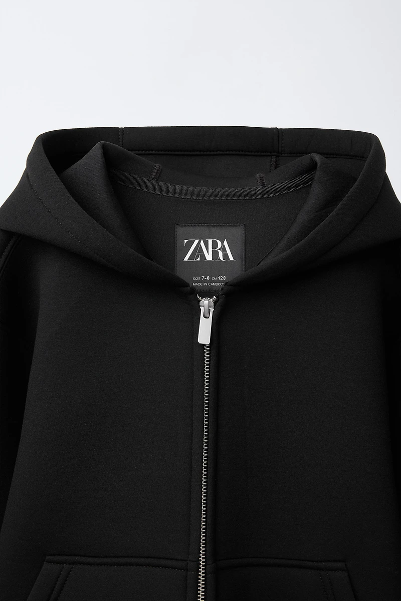 NEOPRENE-LOOK LABEL JACKET