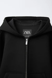 NEOPRENE-LOOK LABEL JACKET
