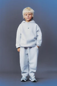 FLEECE LINED BAGGY PANTS WITH LOGO