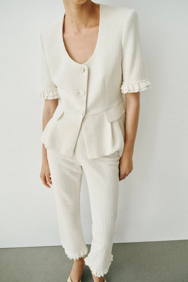 VESTE PEPLUM À VOLANTS ET MANCHES COURTES