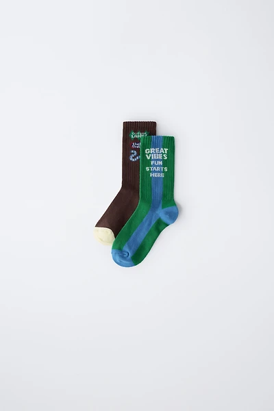 TWO-PACK OF LONG SOCKS WITH TEXT PRINT