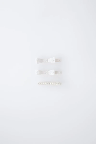 PACK OF THREE MOTHER-OF-PEARL HAIR CLIPS WITH BOWS AND PEARLS