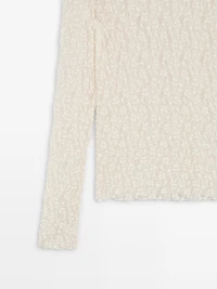 Top en maille de dentelle ajourée à manches longues