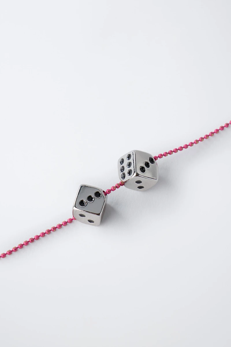 PACK OF TWO DICE AND STAR NECKLACES