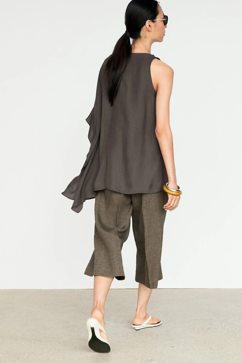 Asymmetric flowing cape top