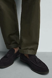 MOCASSINS EN CUIR À POMPONS