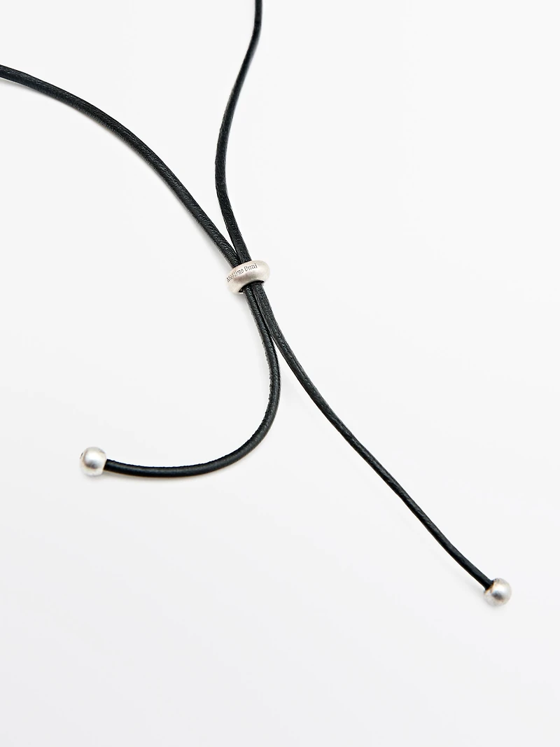 Leather cord necklace with metal piece