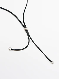 Leather cord necklace with metal piece