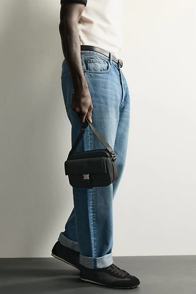 RUBBERIZED CROSSBODY BAG WITH BUCKLE