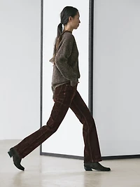 High-waist flocked boot-cut jeans
