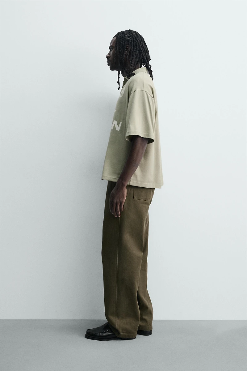 POLO RELAXED FIT TEXTE IMPRIMÉ