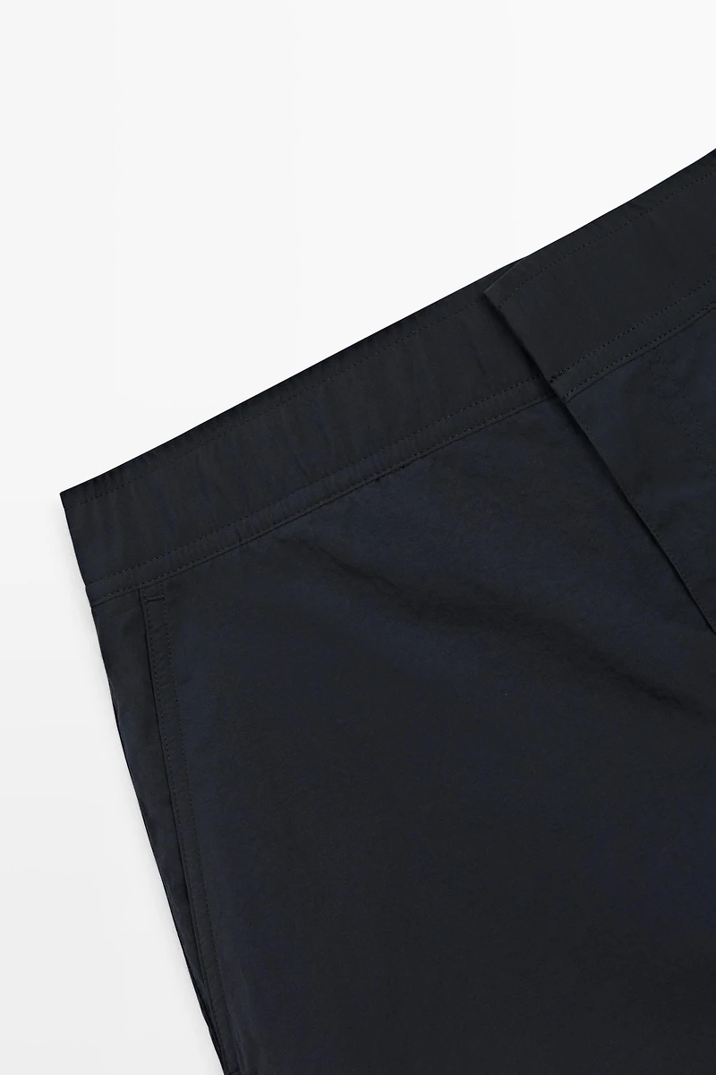 Plain swimming trunks with waist detail