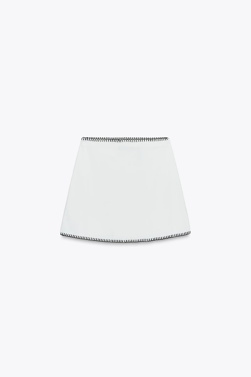 JUPE EN MAILLE BRODERIES CONTRASTE