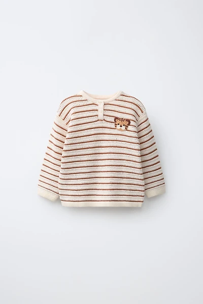 PULL EN MAILLE AVEC PIÈCE LION