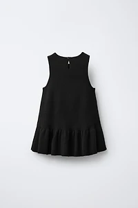 ROBE EN MAILLE AVEC NŒUD ET PAILLETTES