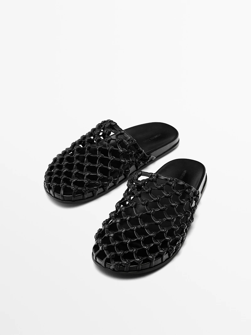 Woven leather clogs