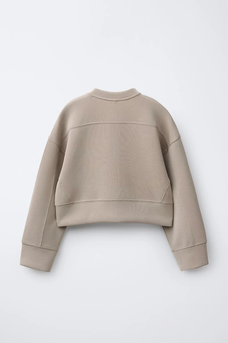 RAISED TEXT SWEATSHIRT